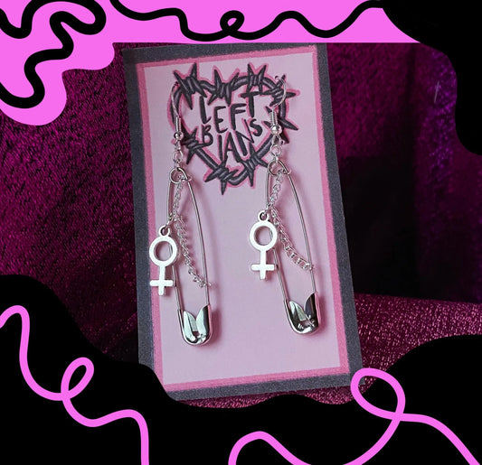 Safety pin earrings with Venus symbol charm Leftbians