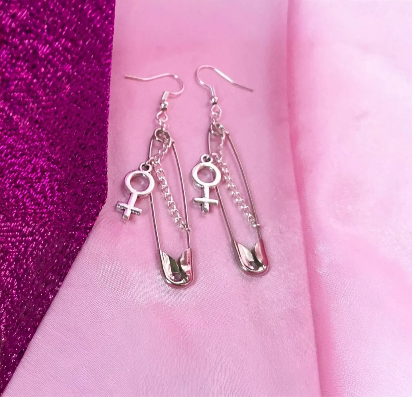 Safety pin earrings with Venus symbol charm Leftbians
