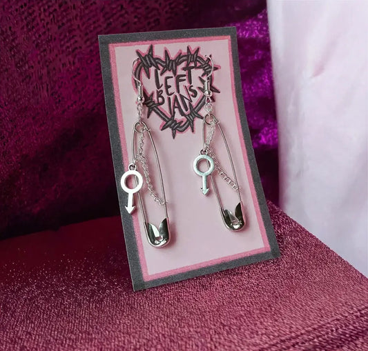 Safety pin earrings with Mars symbol charm Leftbians