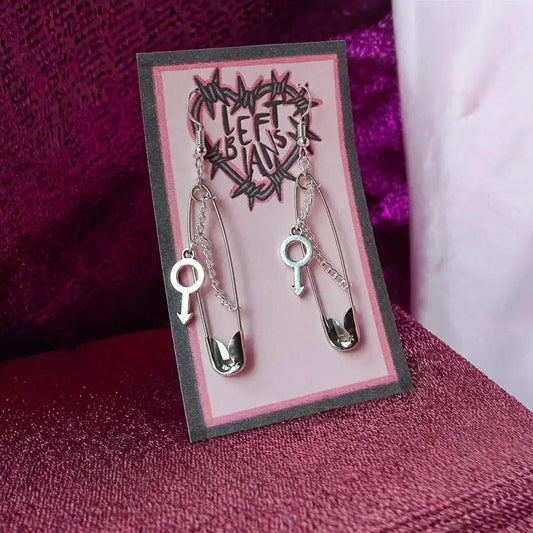 Safety pin earrings with Mars symbol charm Leftbians