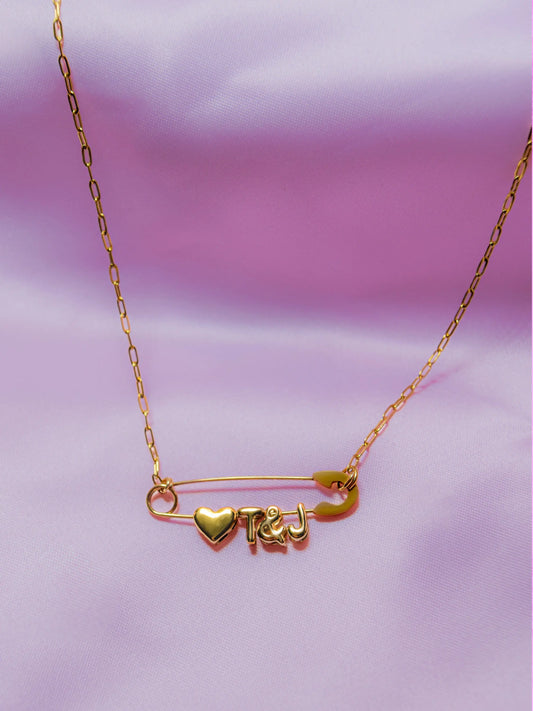Gold safety pin couple heart necklace Leftbians