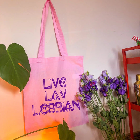 Live Lav Lesbian, pink tote bag with purple vinyl text. Leftbians Collab with Lavender Rodriguez Leftbians