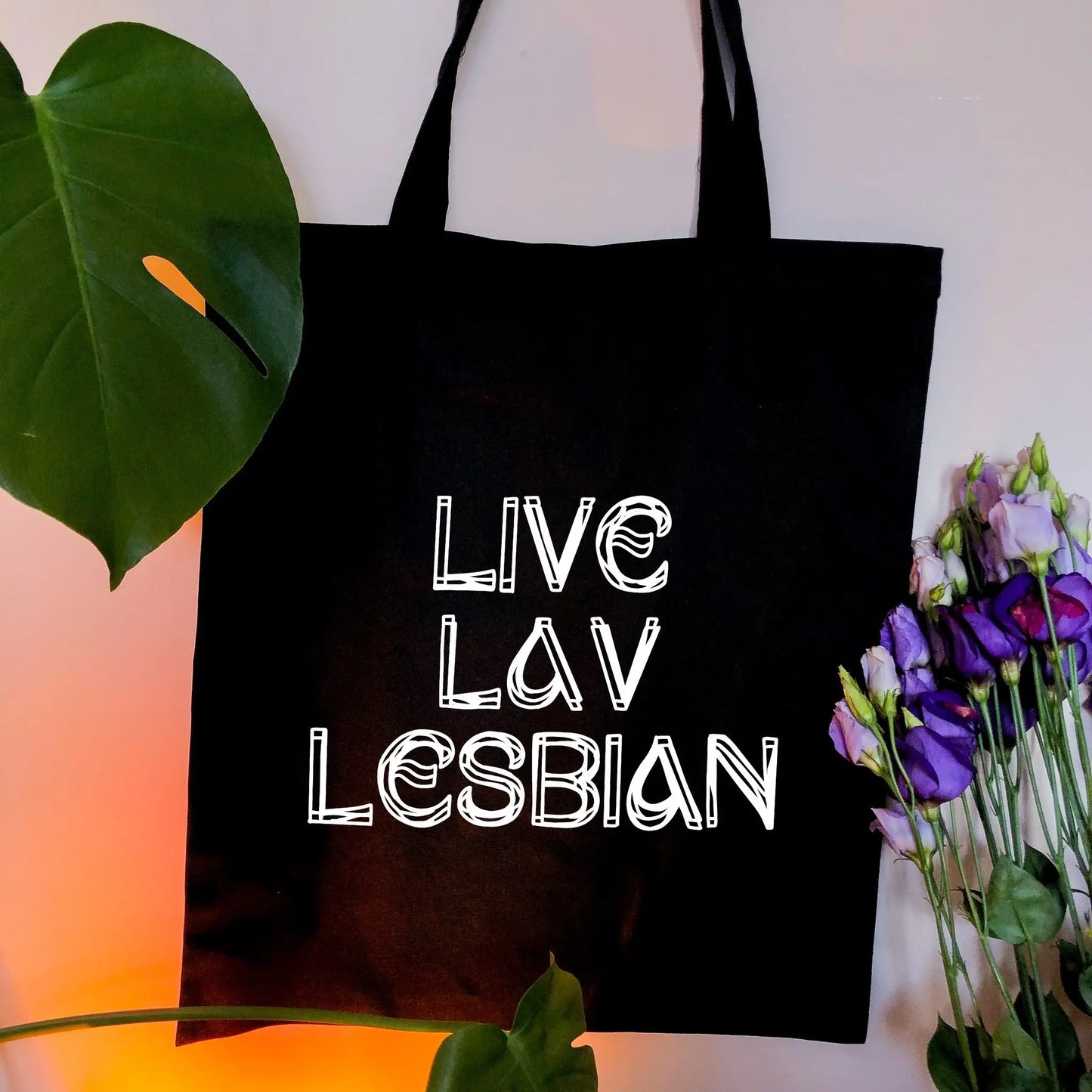 Live Lav Lesbian, black tote bag with white vinyl text. Leftbians Collab with Lavender Rodriguez Leftbians
