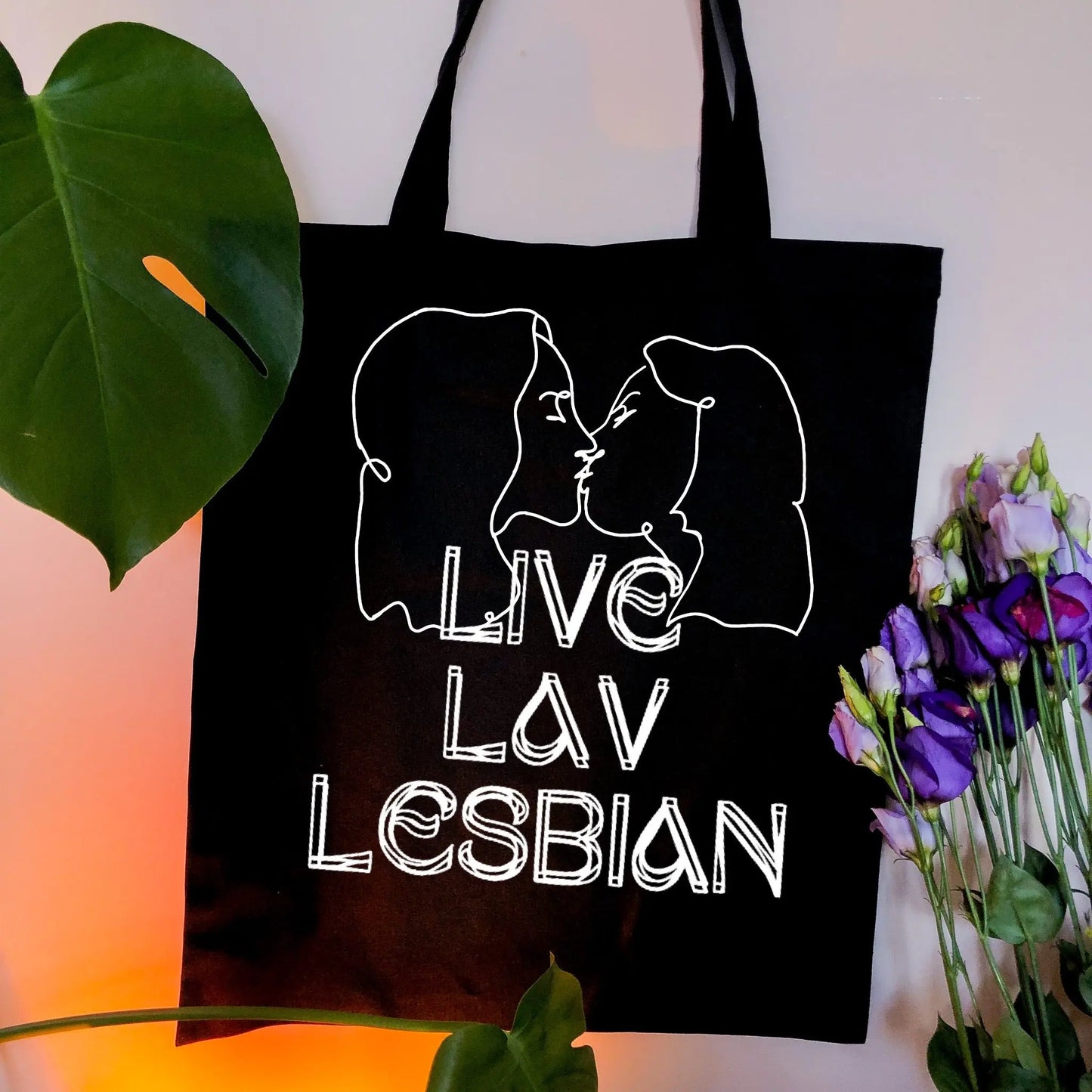 Liv Lav Lesbian, black tote bag with white vinyl text and image. Leftbians Collab with Lavender Rodriguez Leftbians