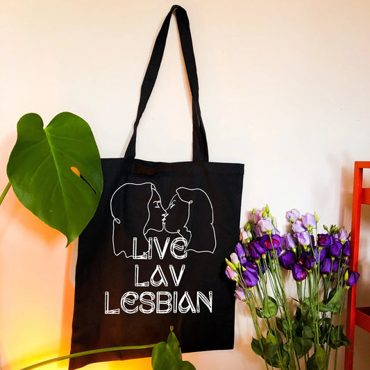 Liv Lav Lesbian, black tote bag with white vinyl text and image. Leftbians Collab with Lavender Rodriguez Leftbians