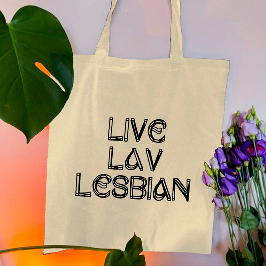 Live Lav Lesbian, Beige tote bag with black vinyl text. Leftbians Collab with Lavender Rodriguez Leftbians