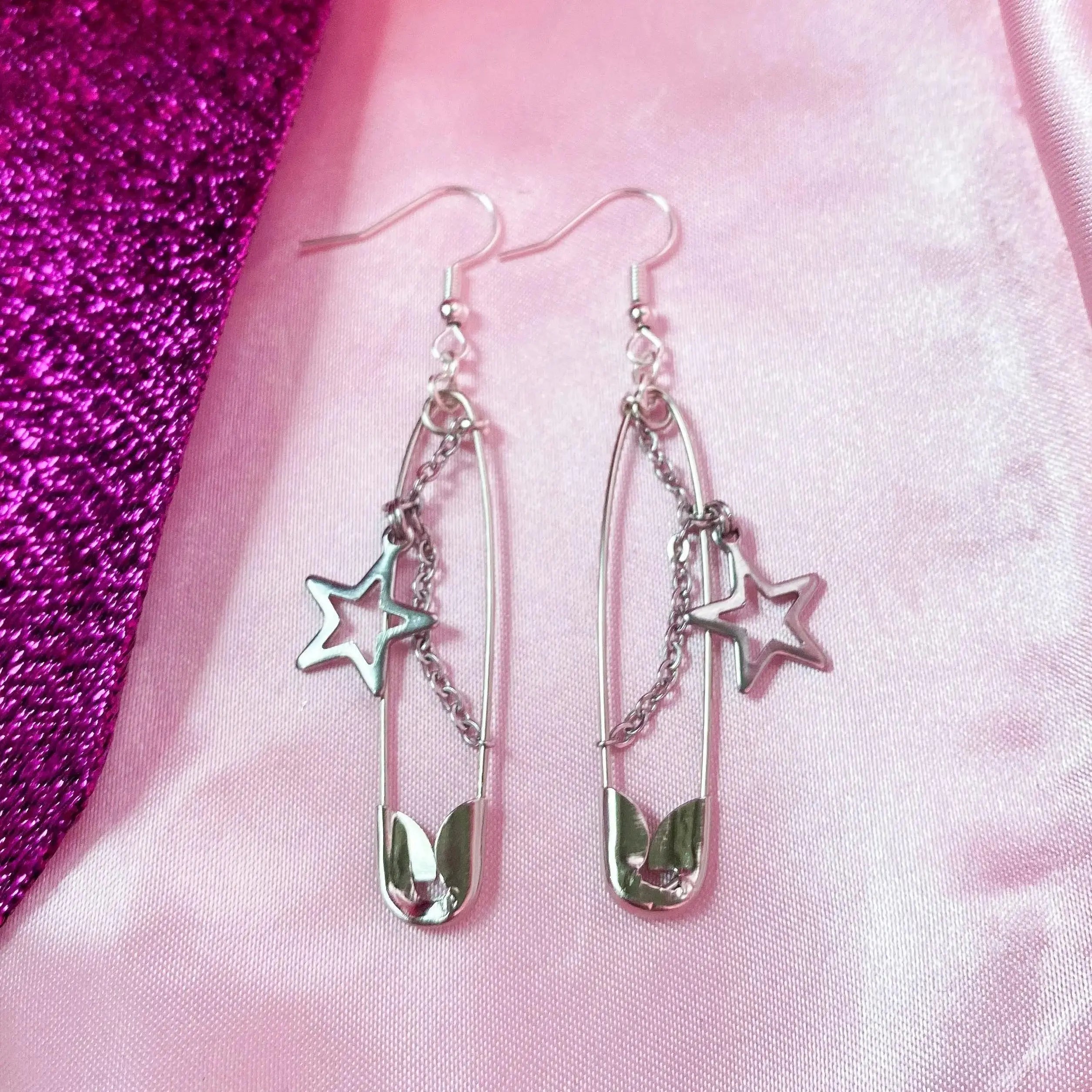 Safety pin with star charm earrings Leftbians