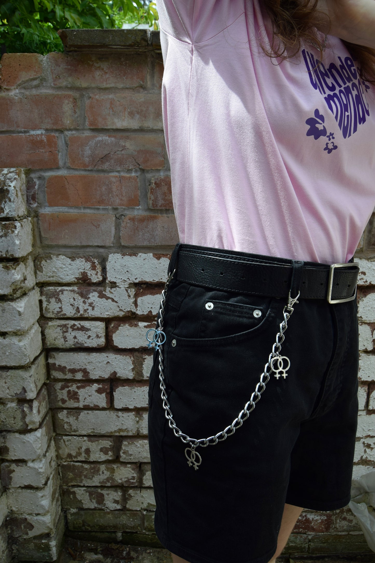 Jean chain with multiple Double Venus symbol charms