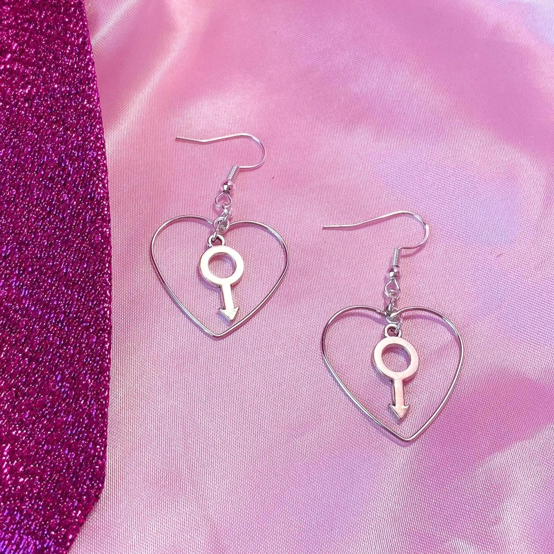 Silver colour heart and Mars charm earrings Leftbians