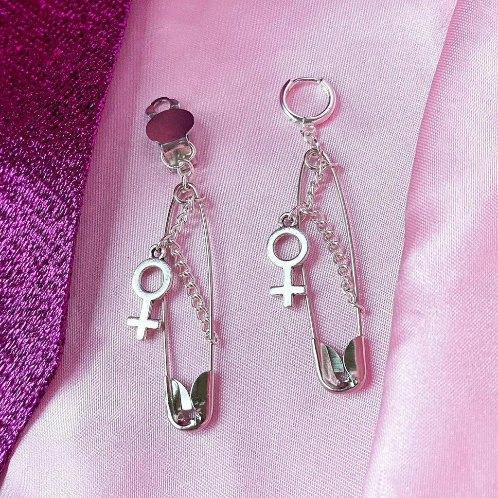 Safety pin earrings with Venus symbol charm Leftbians