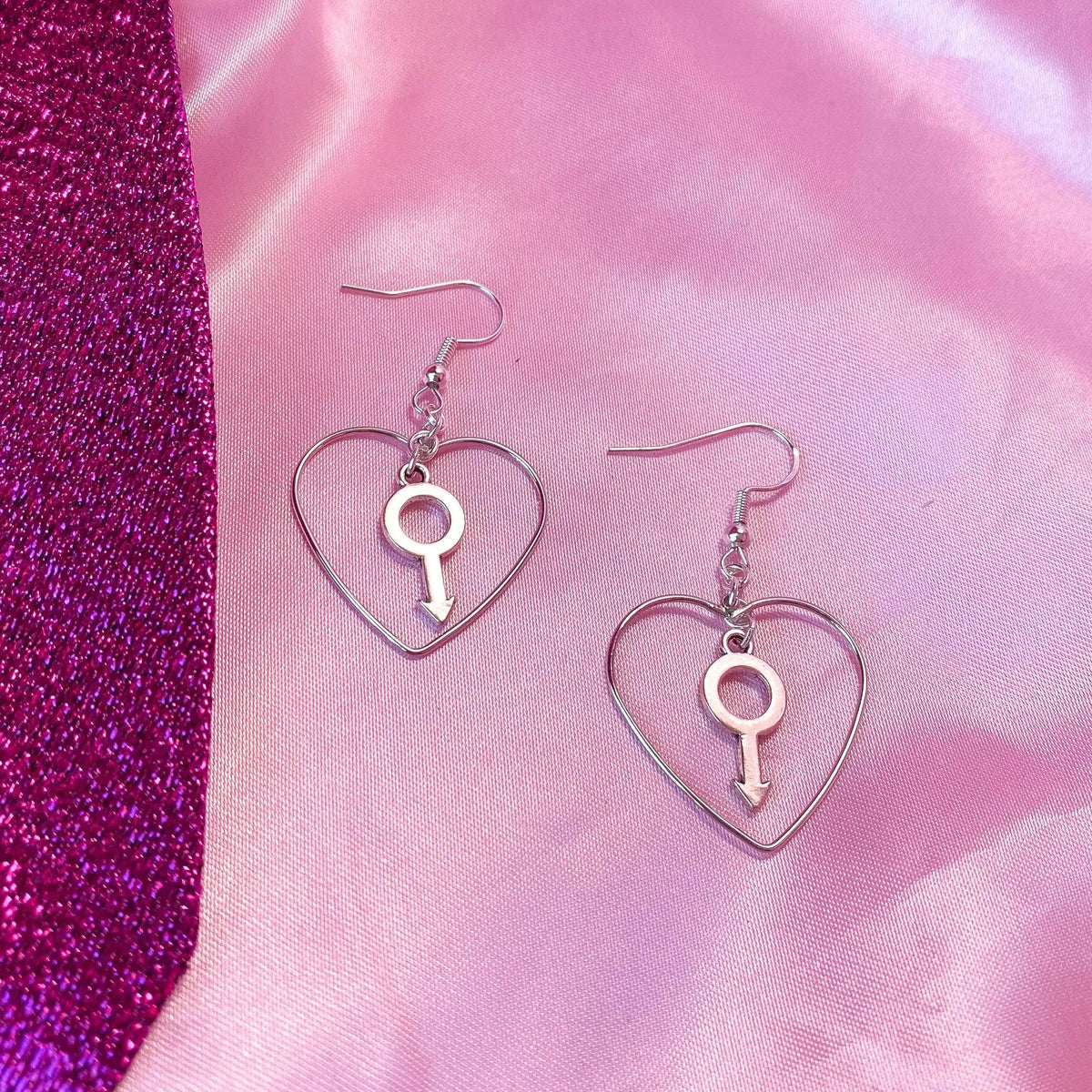 Silver colour heart and Mars charm earrings Leftbians