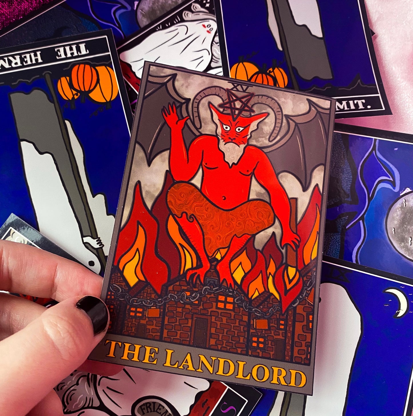 The landlord tarot card sticker, The Devil.