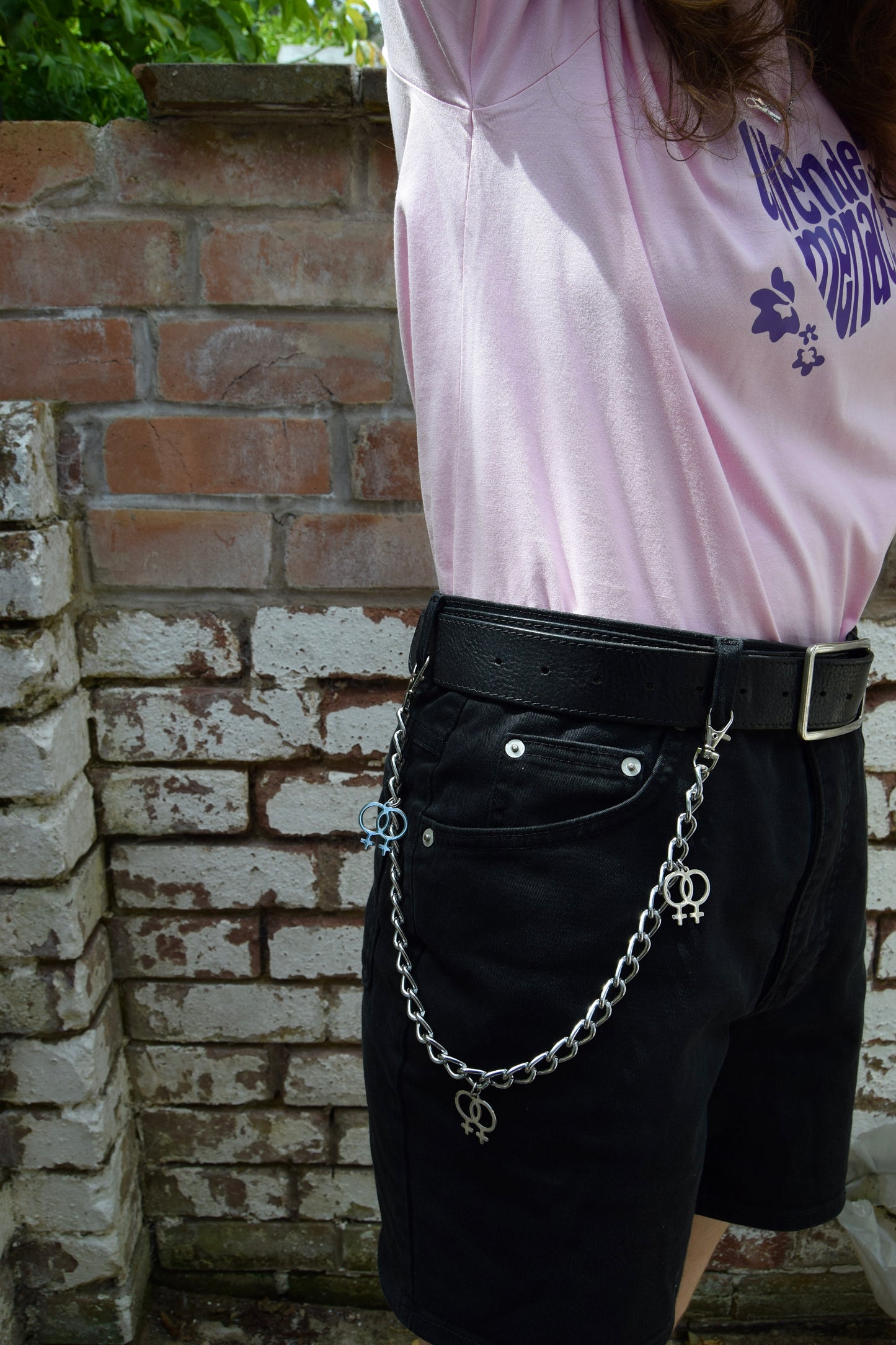 Jean chain with multiple Double Venus symbol charms