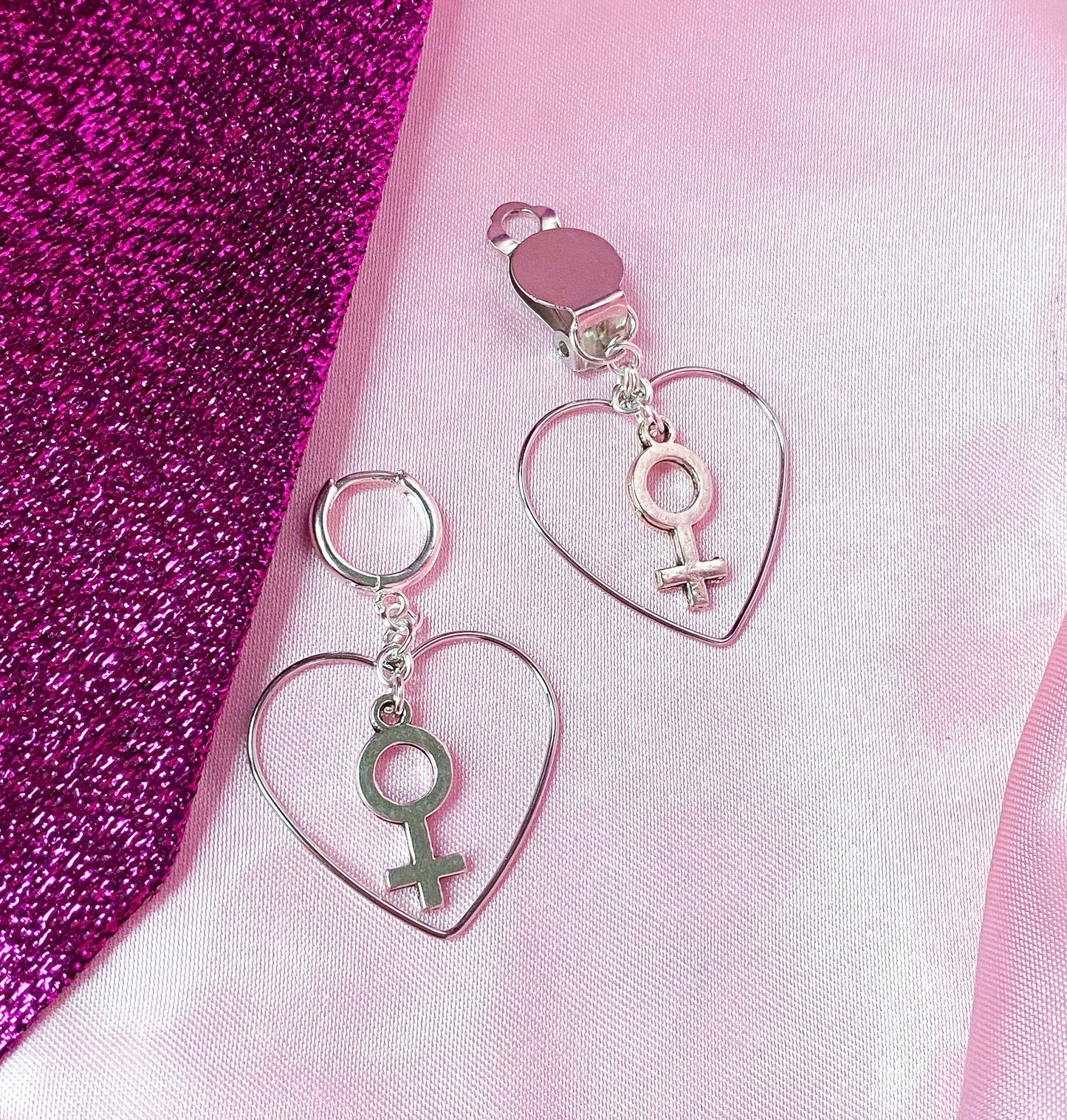 Silver colour heart and Venus charm earrings