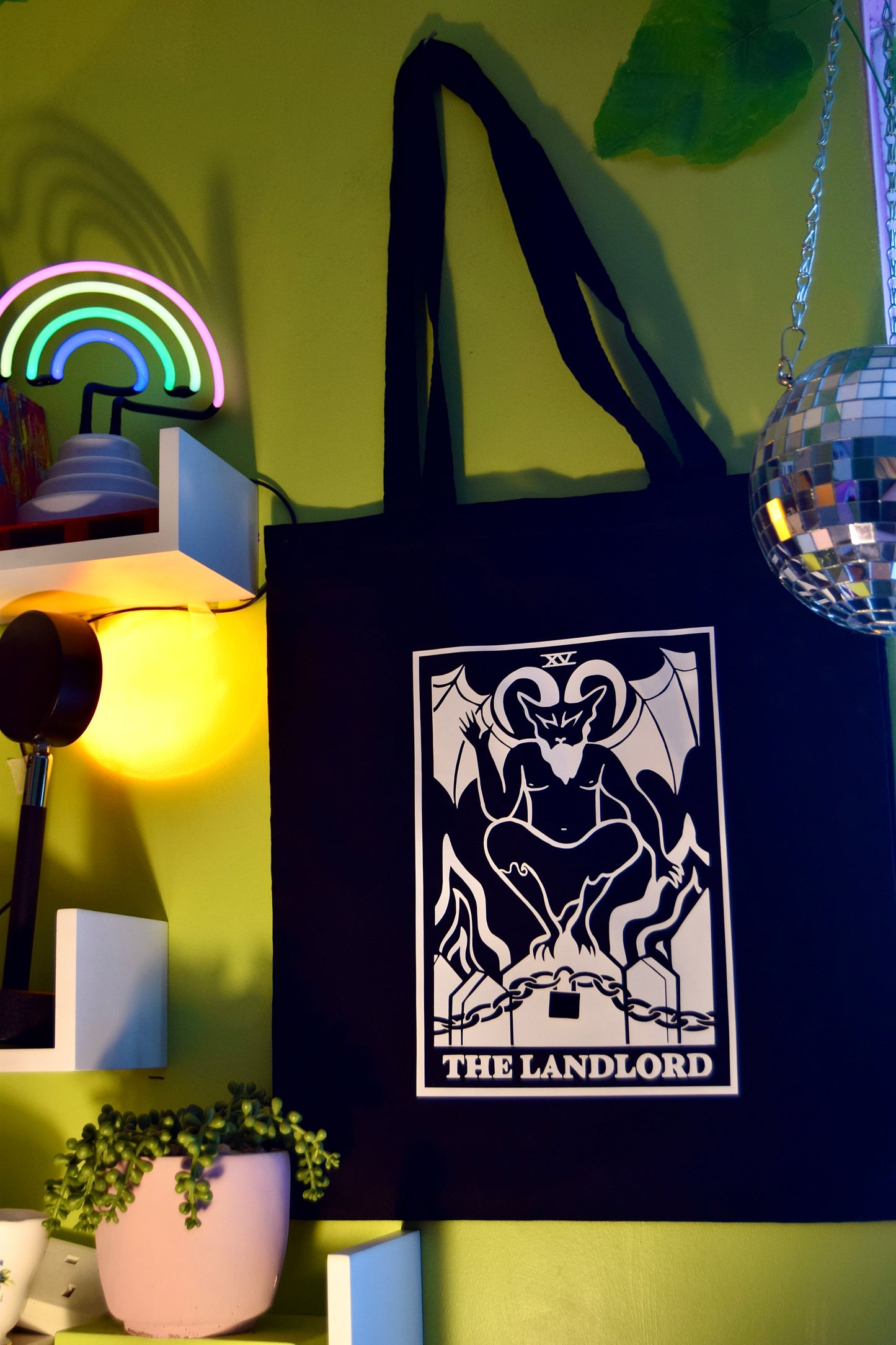 The Landlord tarot card black tote bag