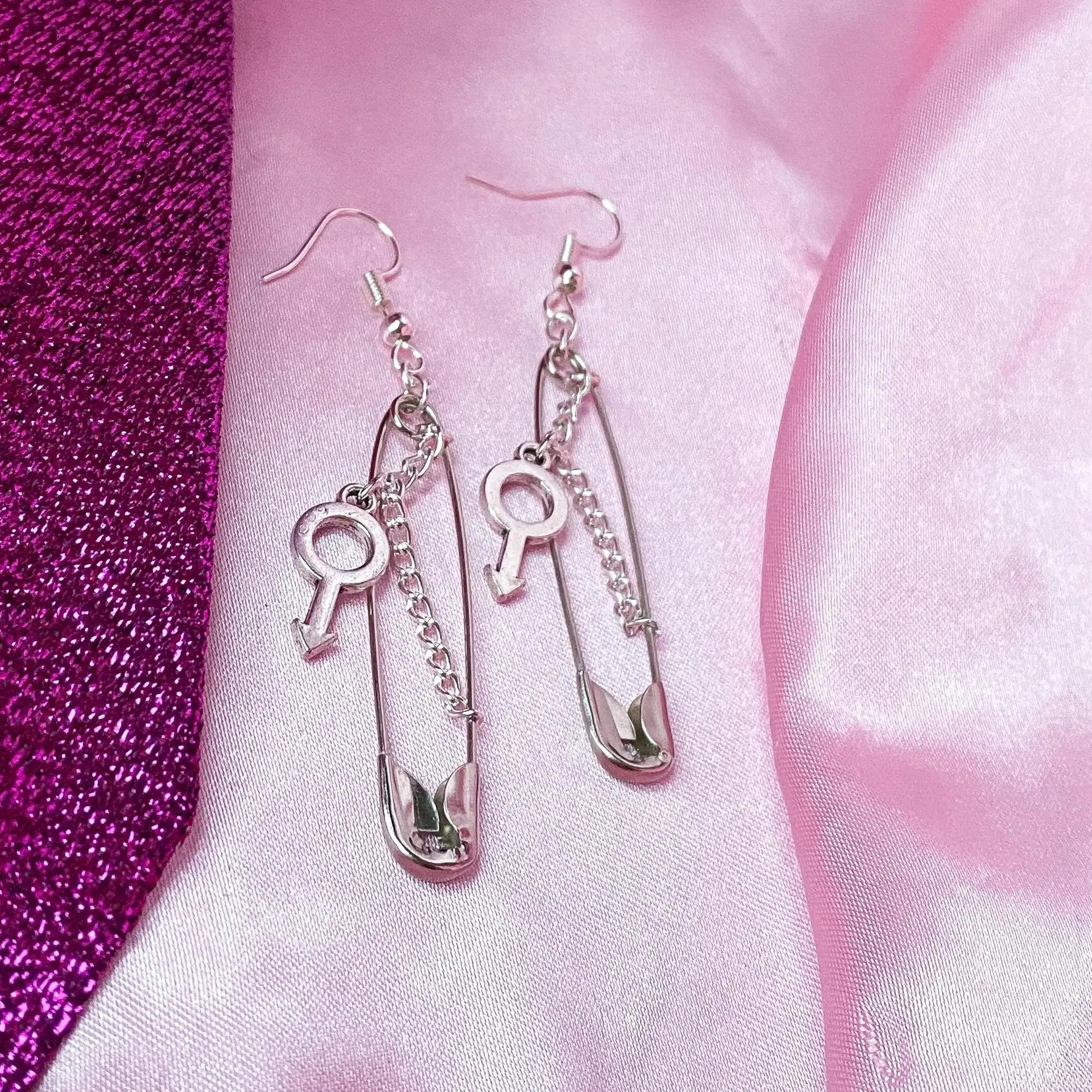 Safety pin earrings with Mars symbol charm Leftbians