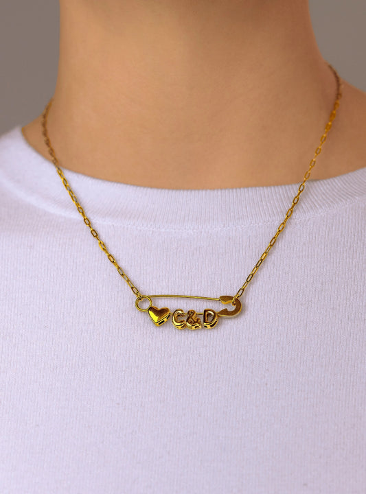 Gold safety pin couple heart necklace Leftbians