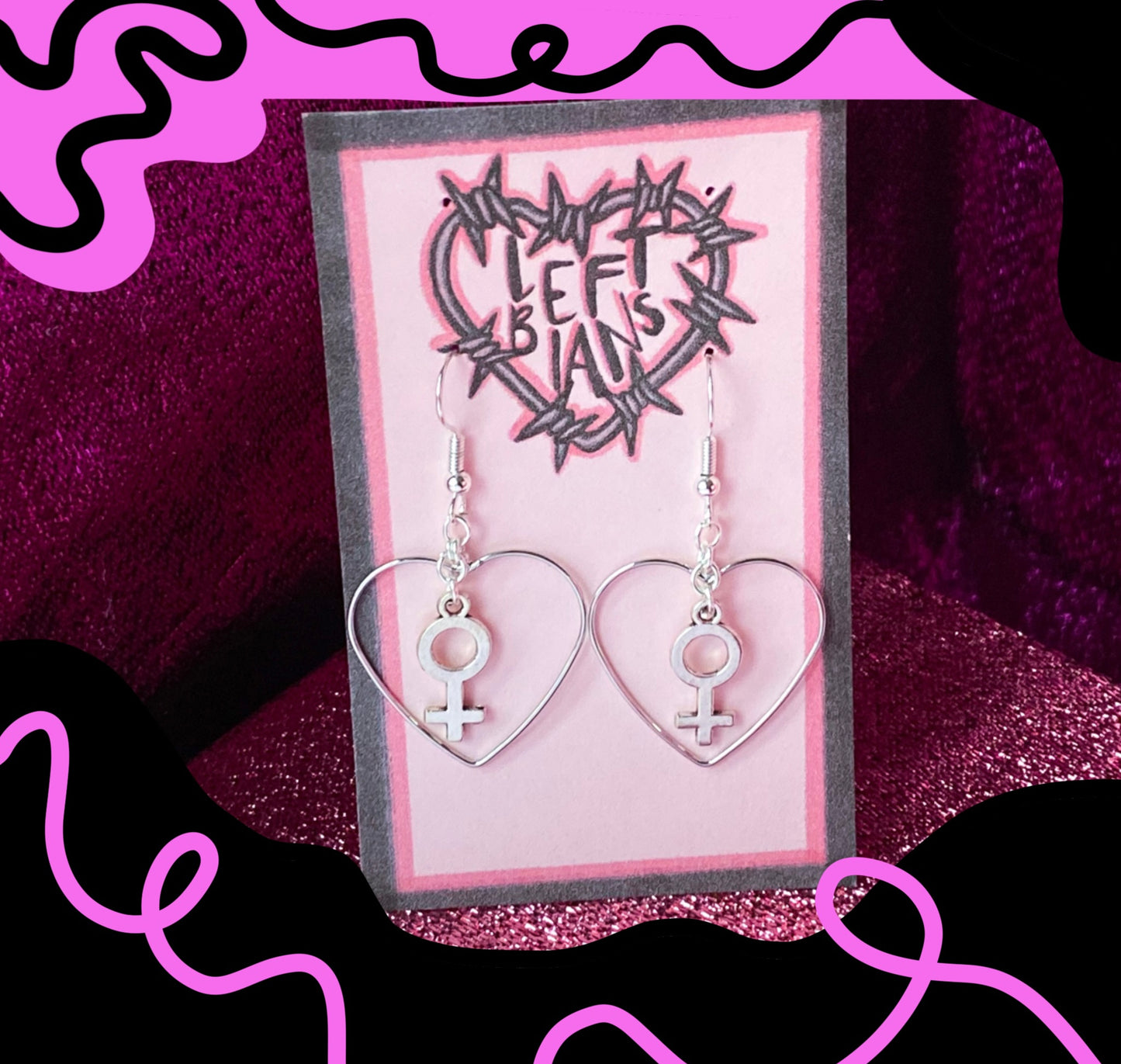 Silver colour heart and Venus charm earrings