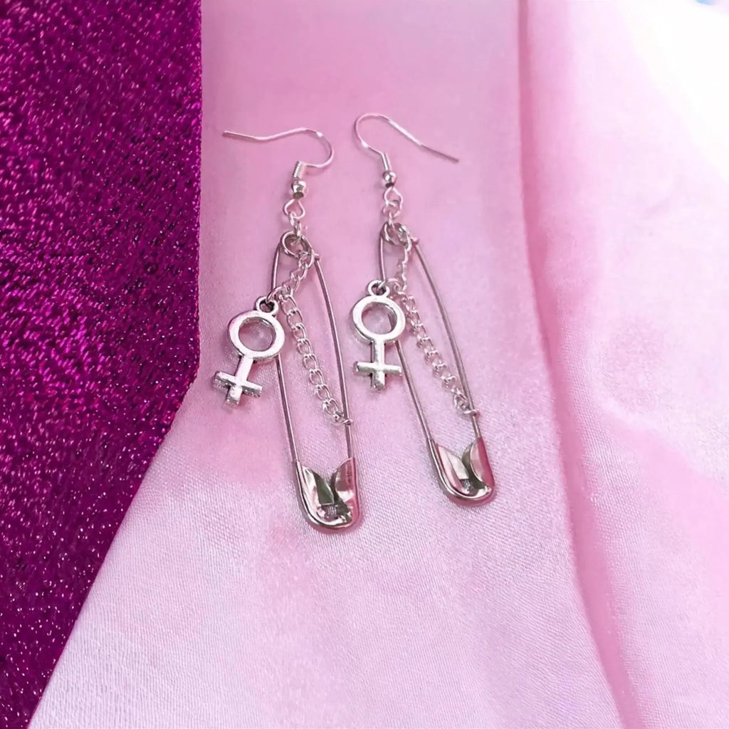 Safety pin earrings with Venus symbol charm Leftbians