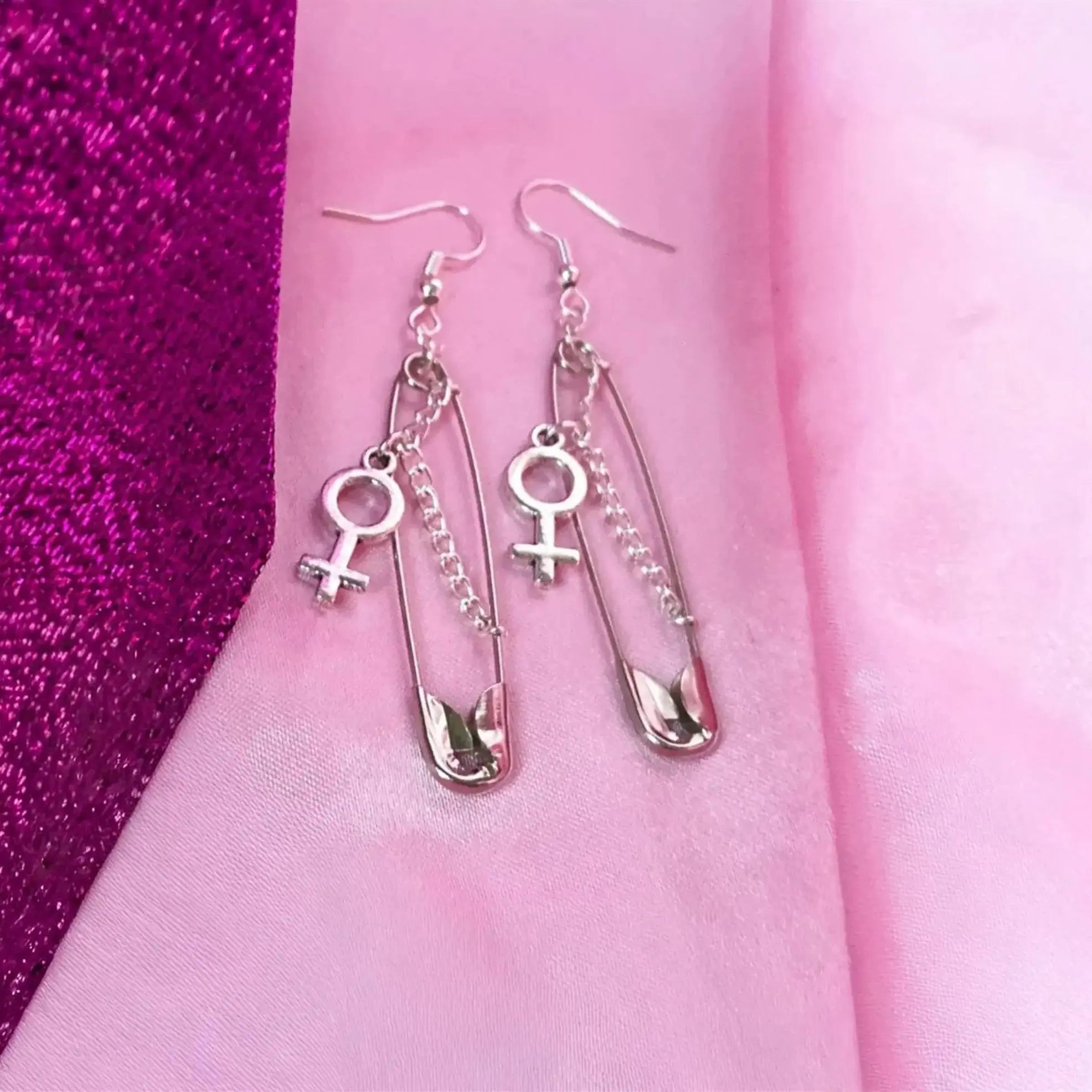 Safety pin earrings with Venus symbol charm Leftbians