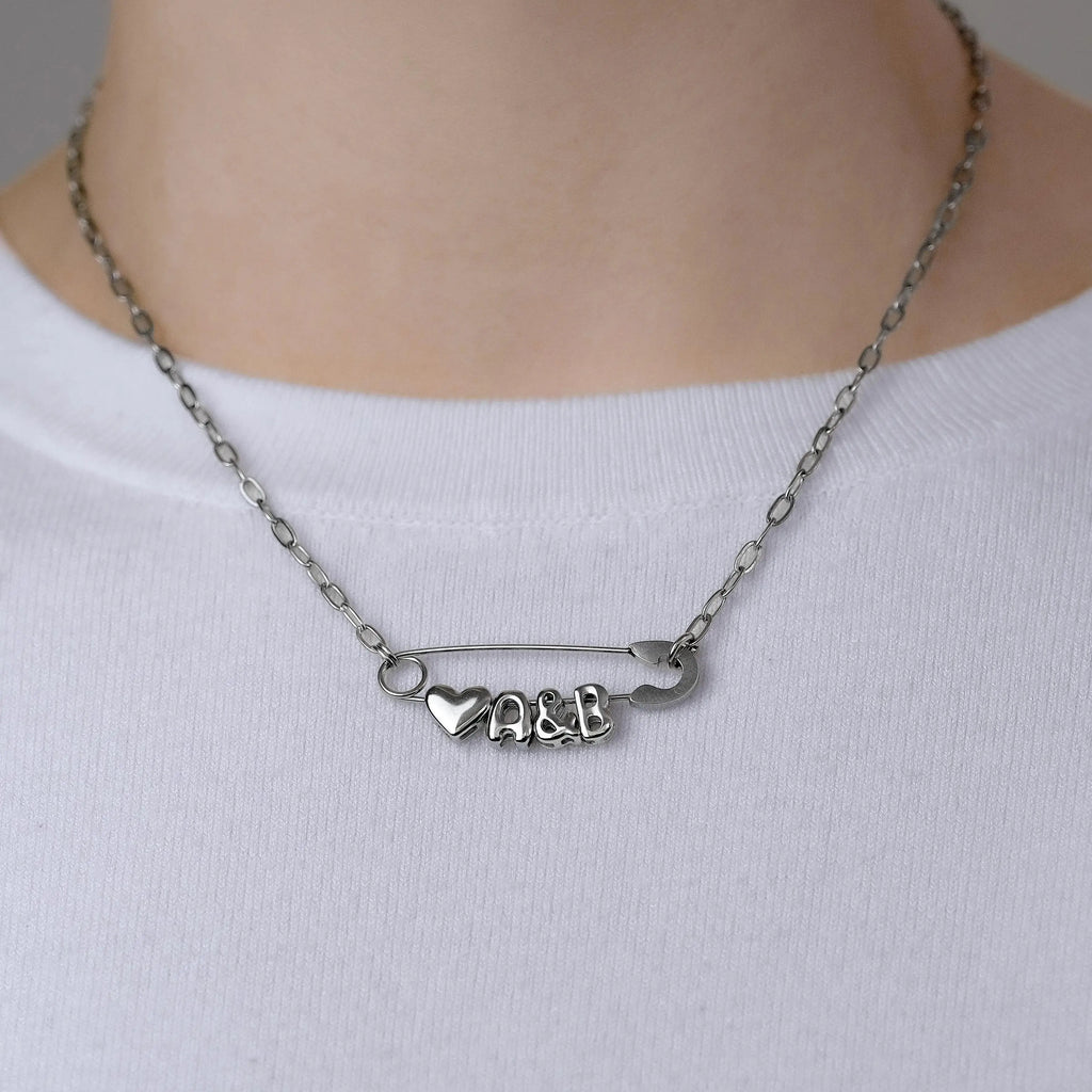 Silver safety pin couple heart necklace Leftbians