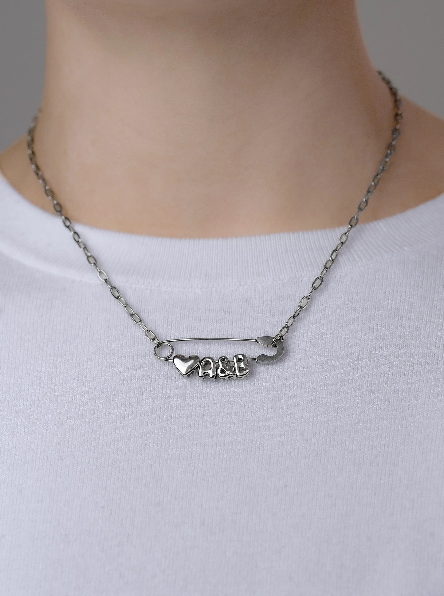 Silver safety pin couple heart necklace Leftbians