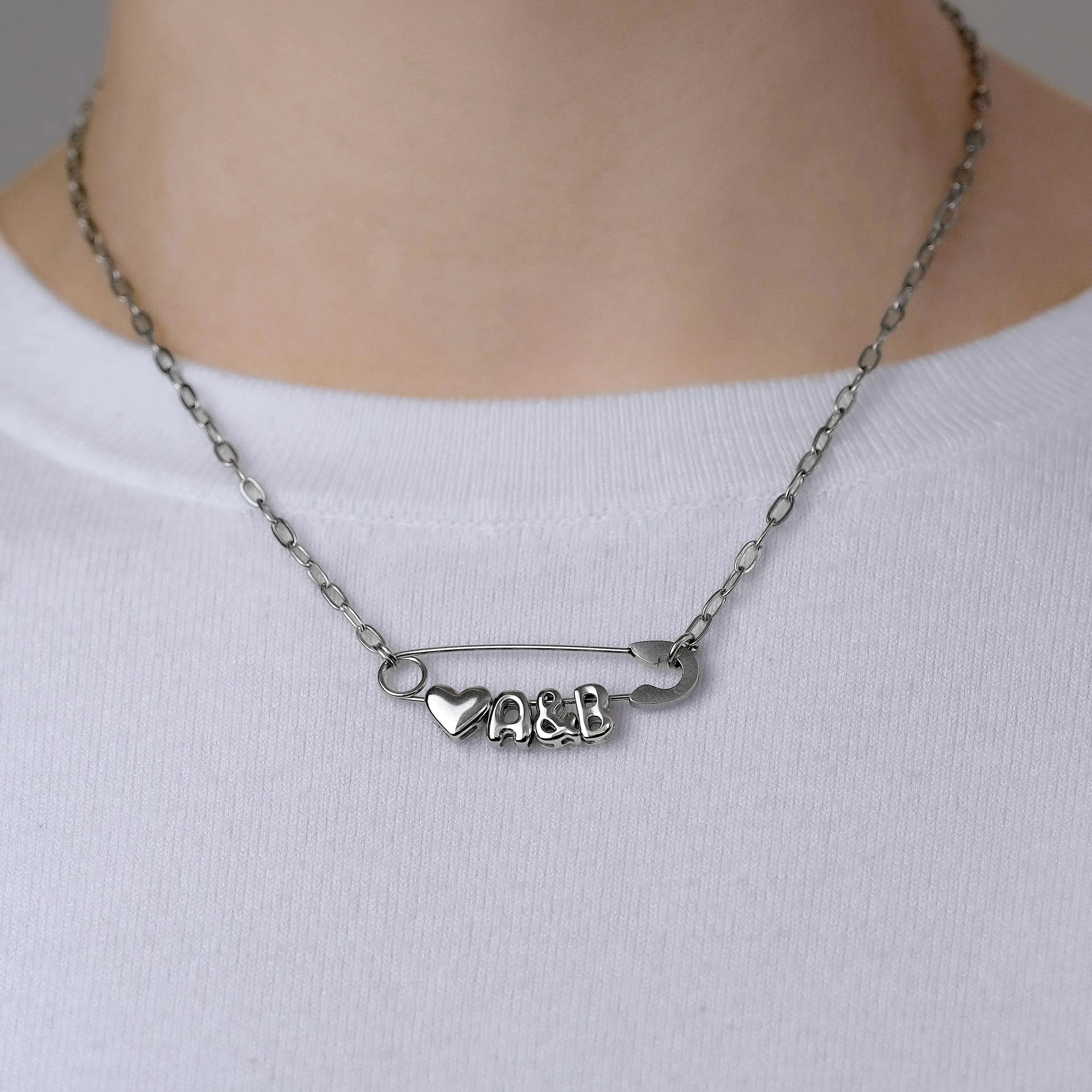 Silver safety pin couple heart necklace Leftbians