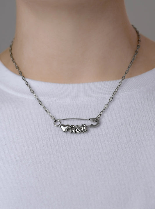 Silver safety pin couple heart necklace Leftbians