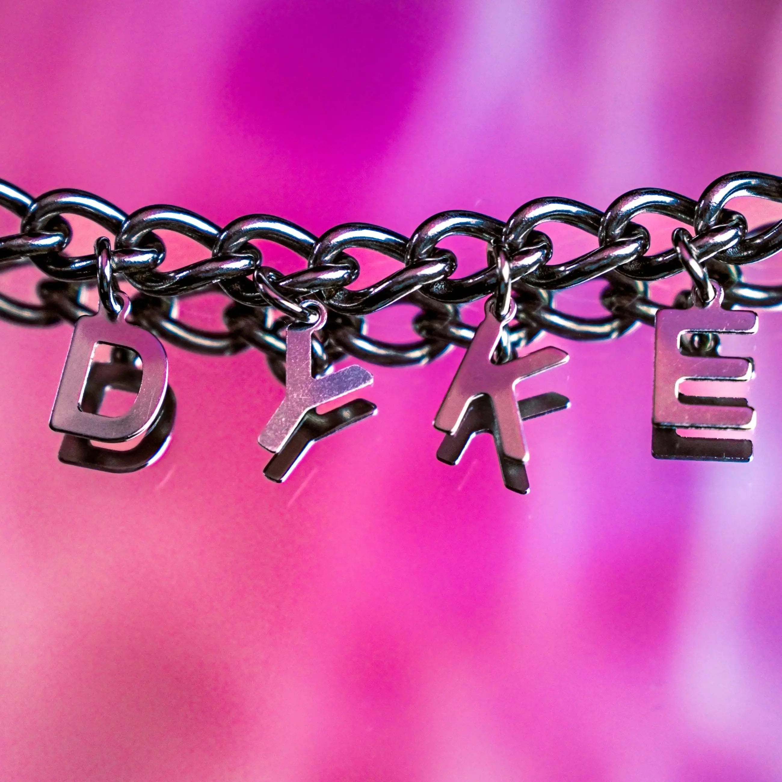 DYKE letter charm chain in stainless steel Leftbians