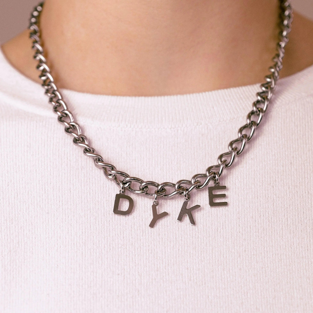 DYKE letter charm chain in stainless steel Leftbians