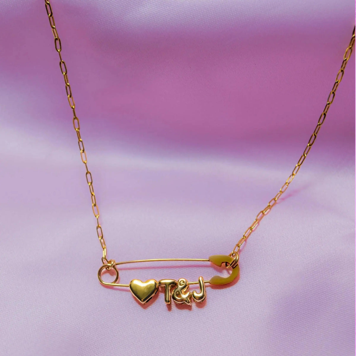 Gold safety pin couple heart necklace Leftbians