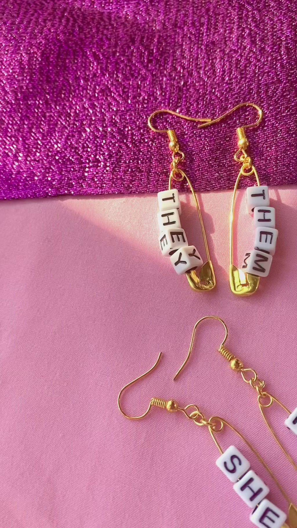Gold safety pin pronoun earrings