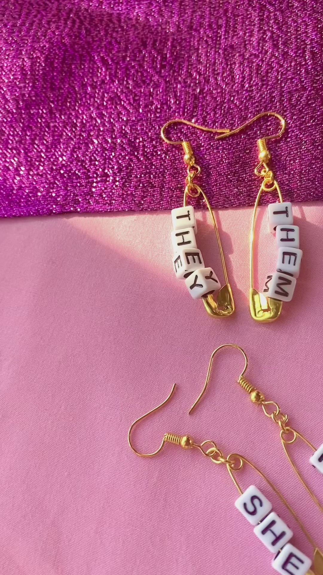 Gold safety pin pronoun earrings