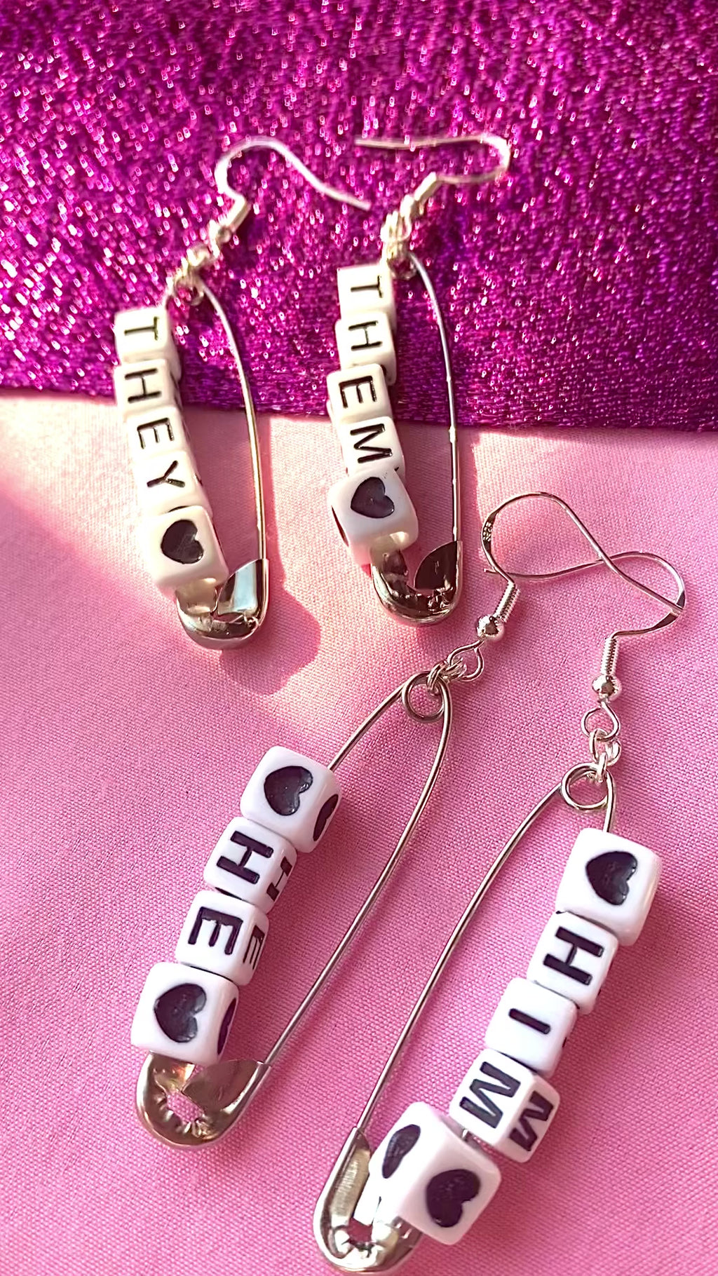 Silver safety pin pronoun earrings