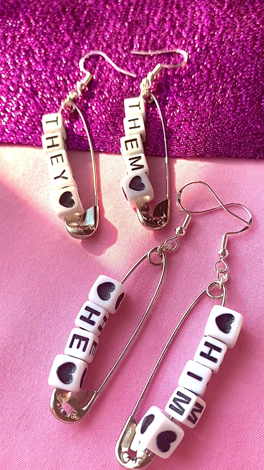 Silver safety pin pronoun earrings