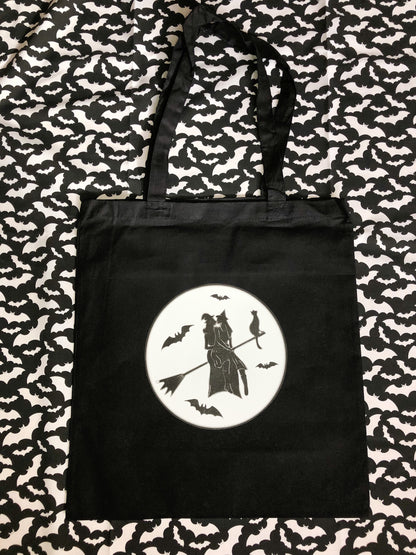 Gay witches on a broomstick, black tote bag