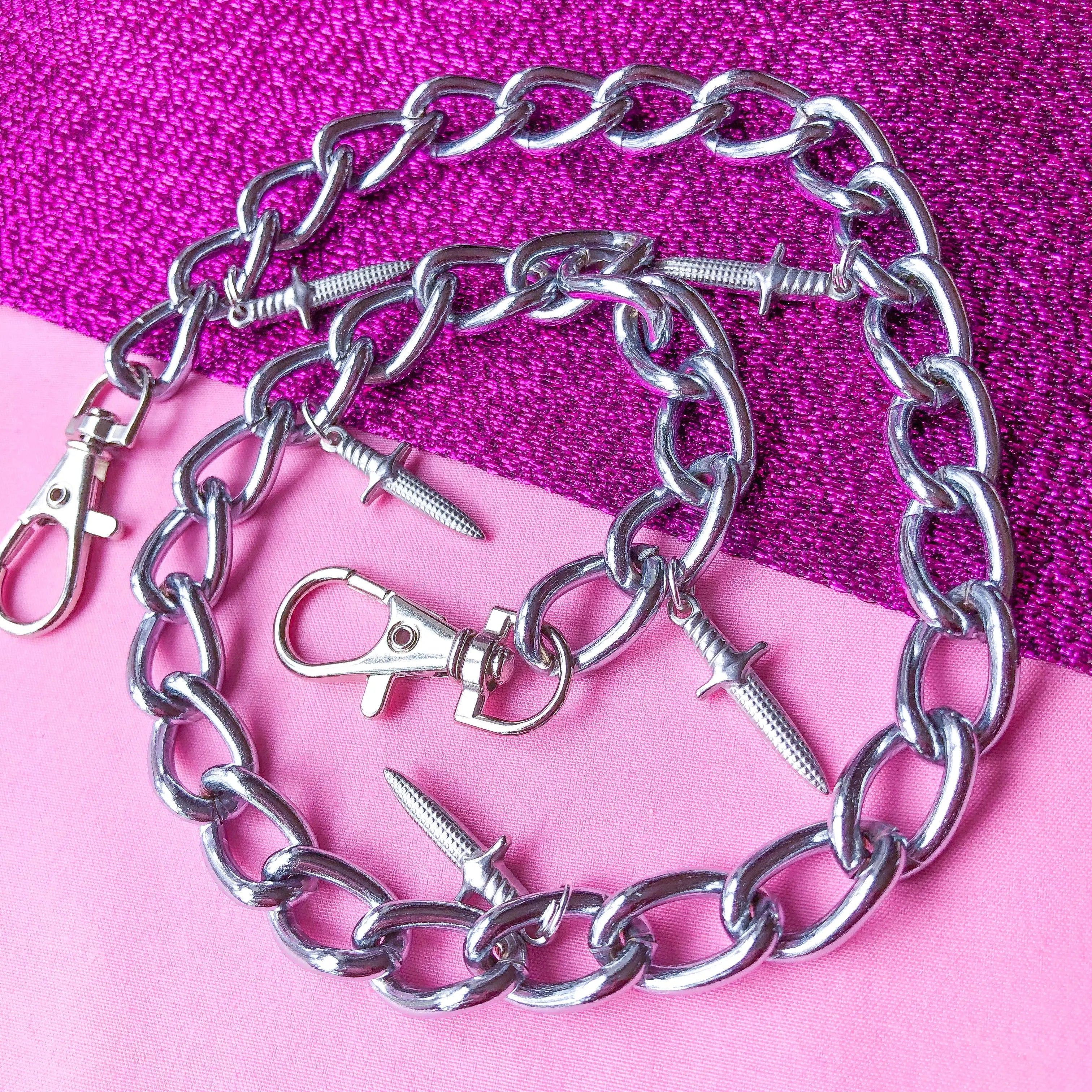 Jean chain with multiple dagger sword charms Leftbians