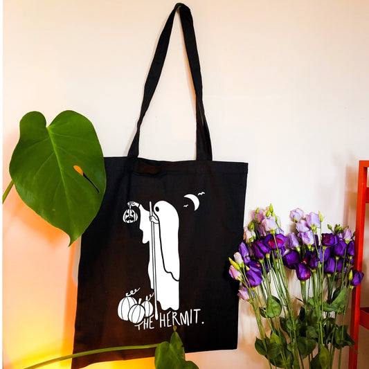 The Hermit tarot card black tote bag