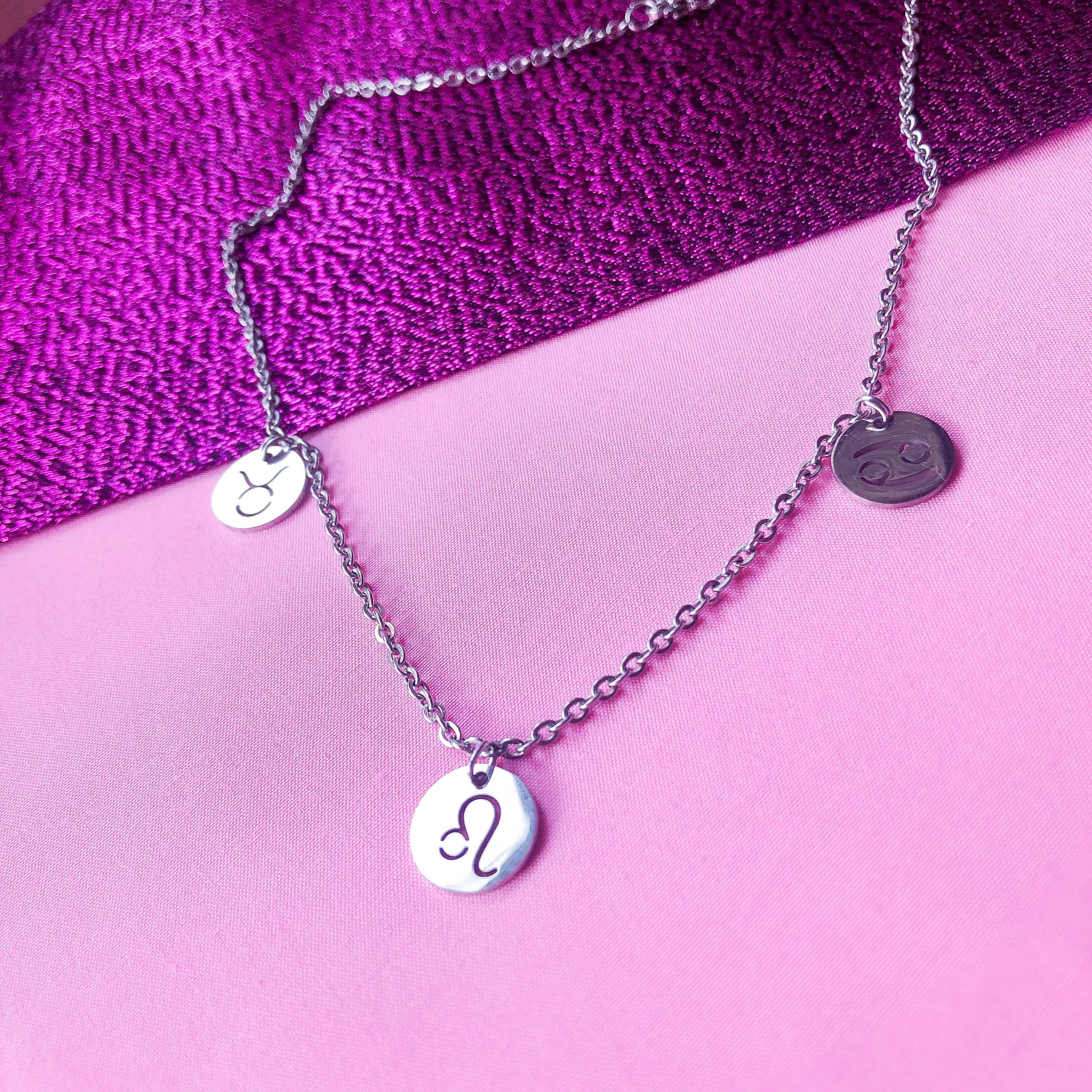 Zodiac star sign necklace with three astrology charms in stainless steel